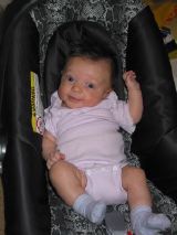 Smiling in her carseat, April 1, 2002